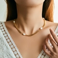 Classic Cuban chain necklace with natural freshwater pearls shown on a female model - Cuban Chain Baroque Pearl Necklace (KN0550)