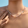 Elegant pearl necklace with colorful heart-shaped glass pendants worn by model outdoors - Heart Colorful Gem Pearl Necklace (KN0564)