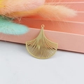 Macro shot of a golden hollow fan-shaped ginkgo leaf charm for DIY earring jewelry making - Matte Gold Fan Shape