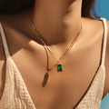 Vintage gold necklace featuring emerald green rectangular stone pendant on linen shirt - Green Gemstone Rectangle Style (SN0019-2)