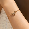 Elegant gold butterfly bracelet featuring sparkling zircon stones and adjustable chain link - Butterfly Design (KB0593)