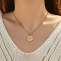 Golden stainless steel sunburst pendant necklace with a turquoise stone inlay - Turquoise Compass Style (SN0021-1)