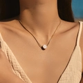 Golden stainless steel sunburst necklace with evil eye pendant on a woman neck - Pink Enamel Evil Eye Style (SN0020-1)