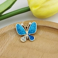 Detail of blue glitter butterfly pendant with gold plating and sparkling rhinestones - Blue and Deep Blue Butterfly