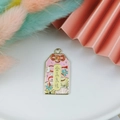 Pink enamel charm with golden rim featuring Jin Yu Liang Yuan text and floral patterns - Golden Jade Marriage