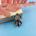 Detail of brown flocked bear charm with black bow and top hole for DIY jewelry - 3D Flocked Bear
