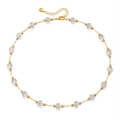 Detailed macro view of the adjustable lobster clasp and gold chain with clear glass beads - Clear Bead Gold Chain Necklace (KN0609-1)
