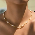 Elegant natural freshwater pearl necklace with gold-plated spiral tubes on model - Spiral Tube Pearl Necklace (KN0595)