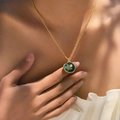 Bohemian 18K gold plated necklace with blue enamel flower and pearl pendant on a model - Dark Blue Enamel Round Flower Style (KN0603-5)