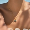 Detail of bohemian gold necklace featuring a pearl-inlaid whale tail pendant on model - Fishtail Rainbow Shell Style (KN0603-6)