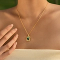 Close-up of gold chain necklace featuring a rectangular green shell inlay pendant - Irregular Rectangular Shell Style (KN0602-7)