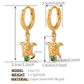 Detail view of 18k gold plated turtle hoop earrings with green zircon stones - Gold Green Eye Turtle (KE1779)