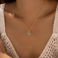Retro style 18K gold plated necklace featuring a turquoise stone oval pendant on a model - Cyan Blue Turquoise Texture Style (KN0611-3)