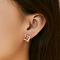 Close-up of model wearing gold square earrings with micro-pave cubic zirconia crystals - Hollow Square Style (KE1680)