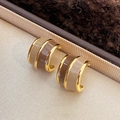 Vintage irregular gold-tone C-shape earrings with coffee enamel finish in a jewelry box - Brown