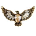 Macro shot of vintage eagle brooch with amber crystal and marquise stones details - Antique Gold Champagne Eagle Brooch