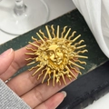 Vintage gold sun goddess embossed brooch for women jackets in artistic retro style - Sun Goddess Style