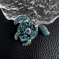Elegant gold-tone turtle brooch with blue rhinestones and faceted sapphire-like crystals - Blue (As Picture)