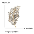 Golden leaf brooch with crystals, size 7.1x4.2cm, elegant fashion accessory for women - White