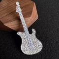 Macro shot of sparkling guitar brooch with white rhinestones on dark wood stand - White Rhinestone (XZ0396-4)