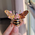 Detailed close-up of a vintage bee brooch with purple crystals and floral enamel inlay - Pink Flower Style (XZ0271-2)