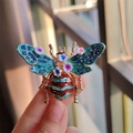 Detailed shot of an enamel bee brooch with floral accents and blue rhinestones - Blue Flower Style (XZ0271-3)