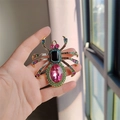 Detailed view of hand-held spider brooch with multicolored rhinestones and crystals - Pink Oval Crystal Large Spider (XZ0498-1)