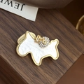 Golden terrier dog brooch with white mother-of-pearl inlay and lucky pouch pendant - Pony with Money Bag Brooch