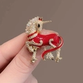 Elegant red enamel unicorn brooch with sparkling white crystals in a gold-plated setting - Red Steed Brooch