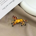 Elegant horse brooch pin in amber enamel finish for suit jackets and fashion accessories - Vintage Horse Brooch Red