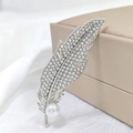 Elegant silver feather brooch with sparkling crystals and a white pearl on white silk - Silver Feather Brooch
