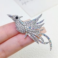 Elegante broche de fénix plateado con brillantes pedrería blanca e iridiscente - Broche de Pájaro con Piedras Color Plata