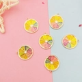 Detail of colorful enamel fruit slice charms including lemon and orange for DIY jewelry - Colorful Lemon