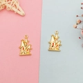 Detail of gold enamel castle charms for DIY jewelry making with red finish accents - Gold