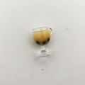 Macro view of miniature bubble tea glass model with brown liquid and black pearls - Light Coffee