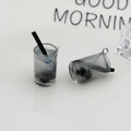 Detailed view of bubble tea resin pendants with metal rings for DIY jewelry making - Silver