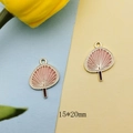 Detailed macro view of 15x20mm gold-plated pink enamel fan charms for DIY jewelry making - 15x20mm / Pink