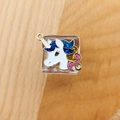 Detailed close-up of a DIY unicorn charm with colorful glitter and double hanging loops - Unicorn Style 2
