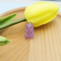 Translucent purple gummy bear resin charm with silver eyelet pin on a wooden tray - Jelly Purple