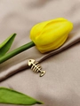 Golden fishbone charm with hollow design on champagne silk fabric with yellow tulip - Fishbone