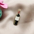 Detailed macro view of a Lafite 1982 red wine bottle enamel pendant for DIY jewelry - Wine Bottle