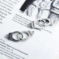 Vintage silver-plated handcuffs earring pendant featuring engraved FREEDOM text detail - Handcuffs