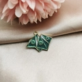Detail of green glitter enamel charm with origami style and heart pattern for DIY jewelry - Origami Game