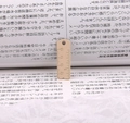 Detailed macro view of a beige mini ruler pendant with clear scale marks for DIY jewelry - Khaki
