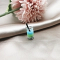 Detailed close-up of a miniature 3D bubble tea pendant with blue and green layers - Style 1 (1)
