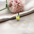 Macro detail of mini bubble tea pendant with yellow gradient liquid and metal hook - Style 3 (3)