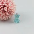 Macro detail of a light blue resin bear pendant with internal glitter for DIY crafts - Light Blue