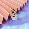 Macro shot of cartoon cat poker card enamel pendant for DIY jewelry making accessories - Red Playing Card Cat