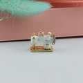 Close-up of white enamel and gold sewing machine pendant with sparkling rhinestones - White