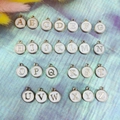 Detailed set of 26 double-sided white A-Z alphabet charms for DIY jewelry making - Letter A